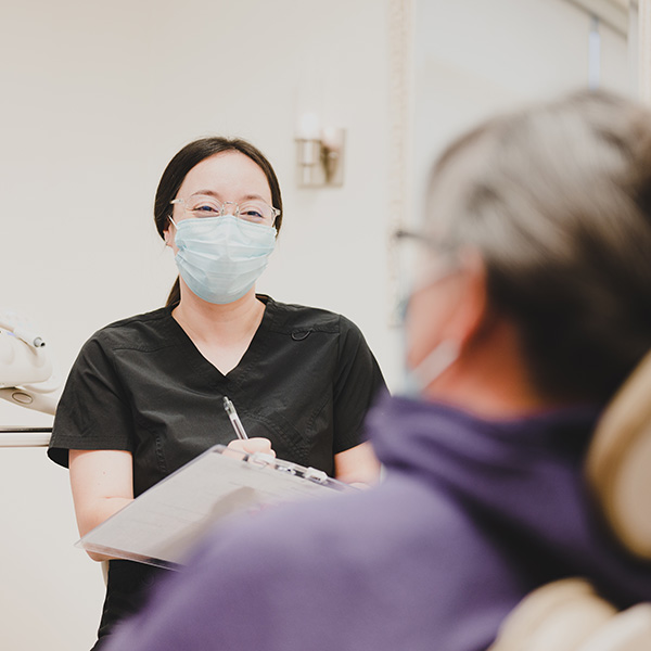dental tech talking to patient